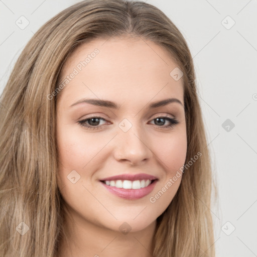 Joyful white young-adult female with long  brown hair and brown eyes