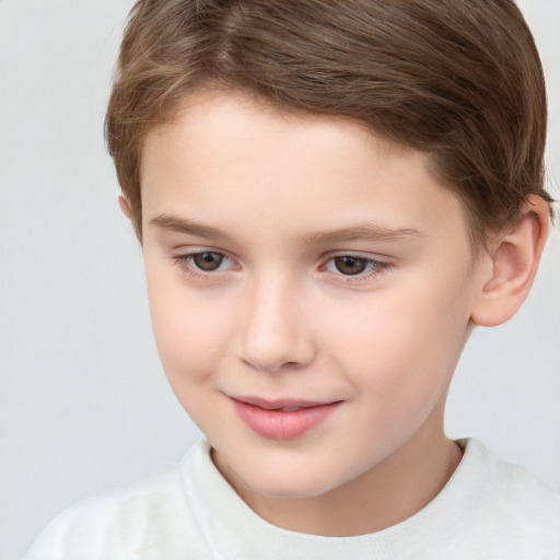 Joyful white child male with short  brown hair and brown eyes