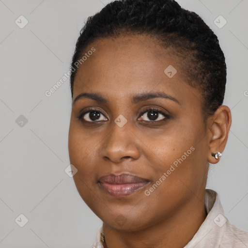 Joyful black young-adult female with short  brown hair and brown eyes