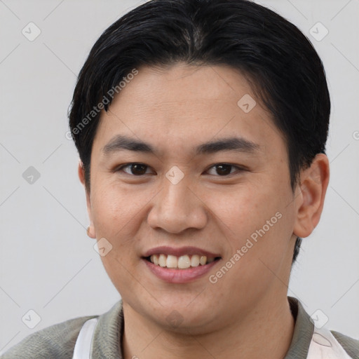 Joyful asian young-adult male with short  brown hair and brown eyes