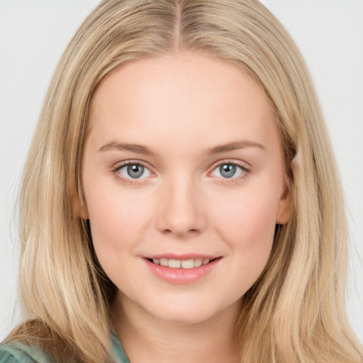 Joyful white young-adult female with long  brown hair and blue eyes