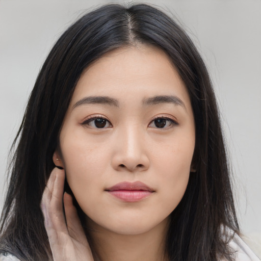 Neutral asian young-adult female with long  brown hair and brown eyes