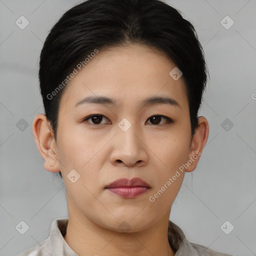 Joyful asian young-adult female with short  black hair and brown eyes