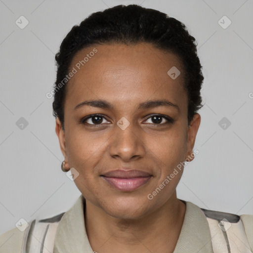 Joyful black young-adult female with short  black hair and brown eyes