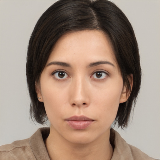 Neutral asian young-adult female with medium  brown hair and brown eyes