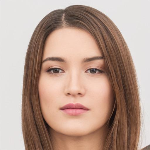 Neutral white young-adult female with long  brown hair and brown eyes