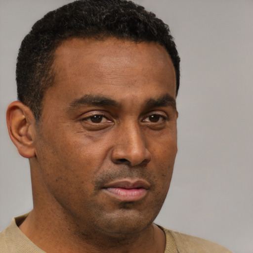 Neutral black young-adult male with short  brown hair and brown eyes