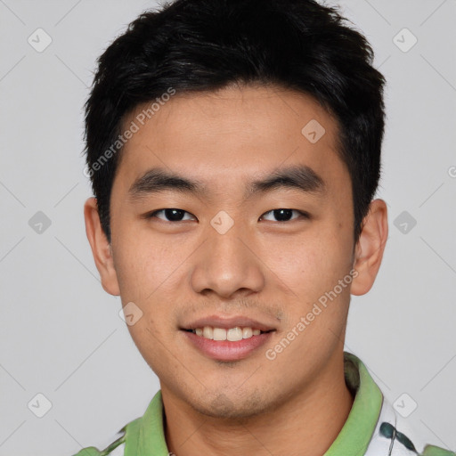 Joyful asian young-adult male with short  black hair and brown eyes