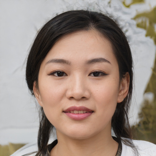Joyful white young-adult female with medium  black hair and brown eyes
