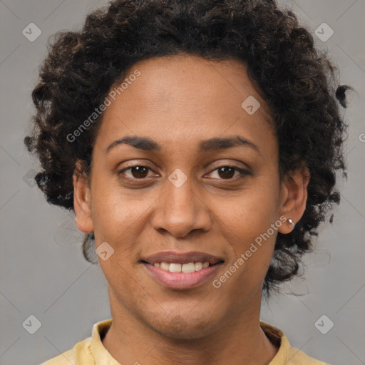 Joyful black young-adult female with short  brown hair and brown eyes