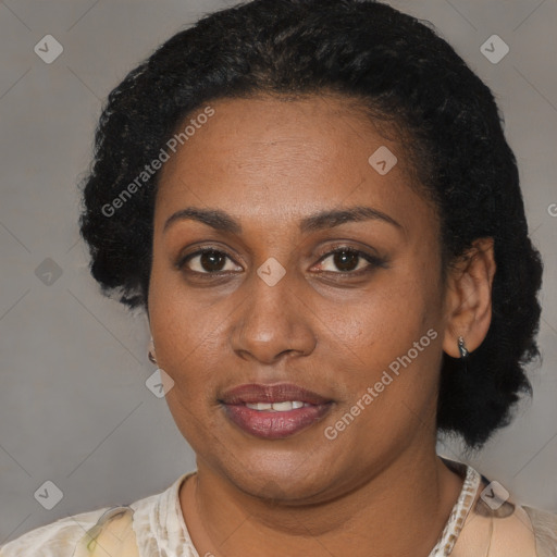 Joyful black young-adult female with short  brown hair and brown eyes