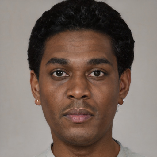 Neutral black young-adult male with short  black hair and brown eyes