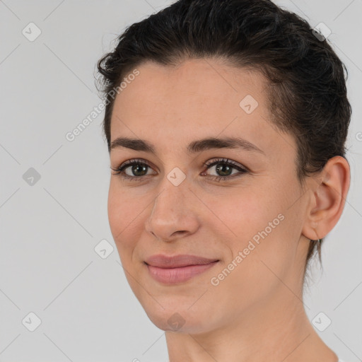 Joyful white young-adult female with short  brown hair and brown eyes