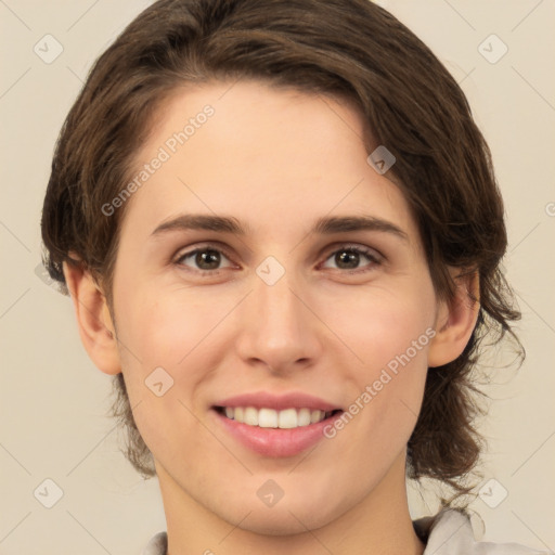 Joyful white young-adult female with medium  brown hair and green eyes