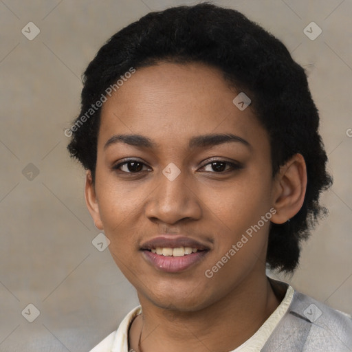 Joyful black young-adult female with short  black hair and brown eyes