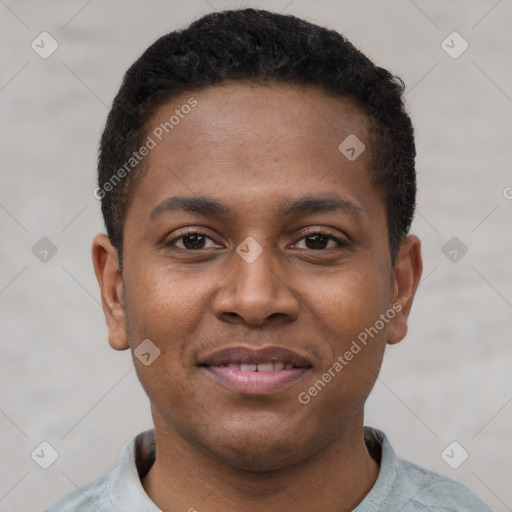 Joyful latino young-adult male with short  brown hair and brown eyes