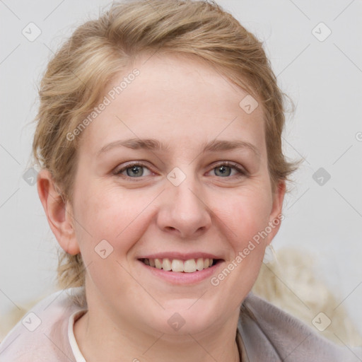 Joyful white young-adult female with medium  brown hair and blue eyes