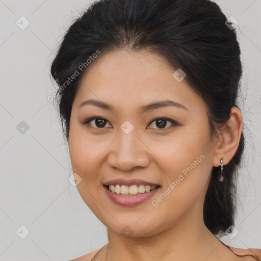 Joyful asian young-adult female with long  brown hair and brown eyes