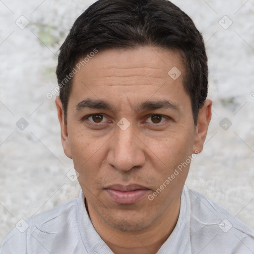 Joyful white adult male with short  black hair and brown eyes