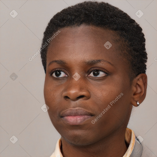 Joyful black young-adult female with short  brown hair and brown eyes