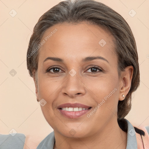 Joyful white adult female with medium  brown hair and brown eyes