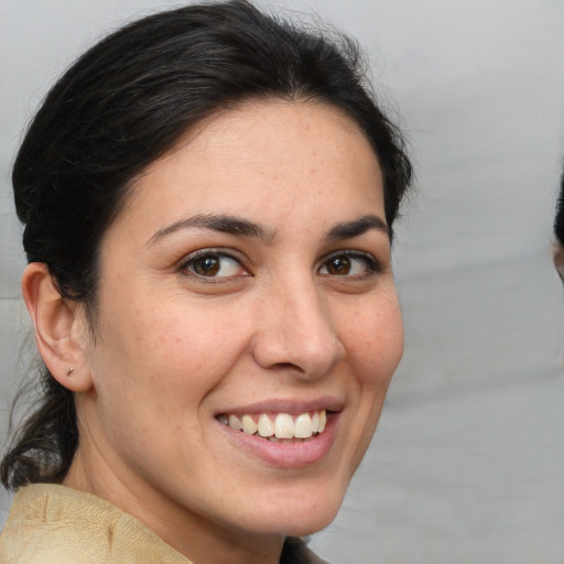 Joyful white young-adult female with medium  brown hair and brown eyes