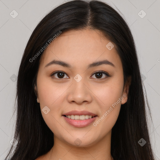 Joyful asian young-adult female with long  brown hair and brown eyes