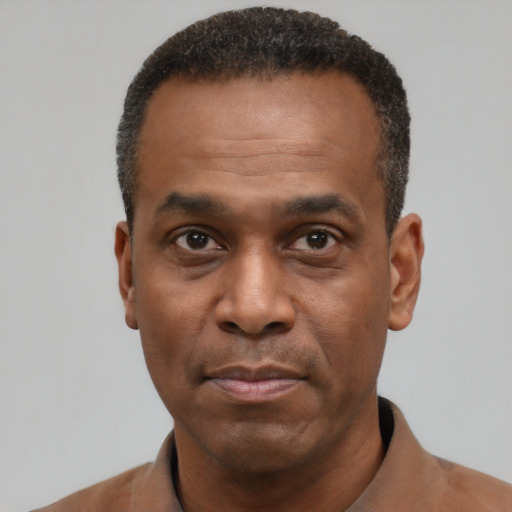 Neutral latino adult male with short  black hair and brown eyes