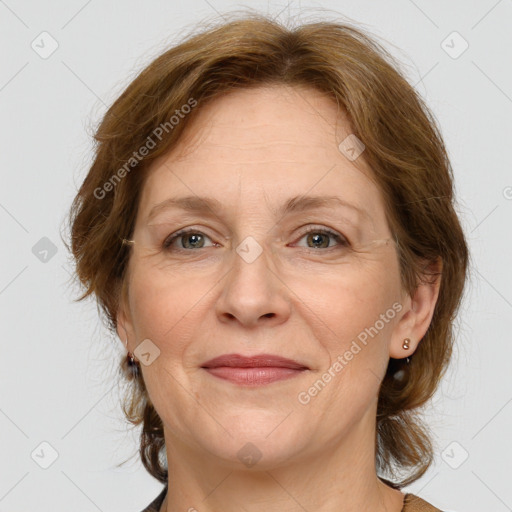 Joyful white adult female with medium  brown hair and grey eyes