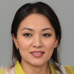 Joyful white young-adult female with medium  brown hair and brown eyes