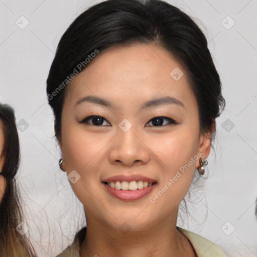 Joyful asian young-adult female with medium  brown hair and brown eyes