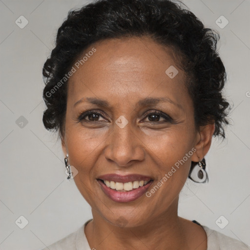 Joyful black adult female with short  brown hair and brown eyes