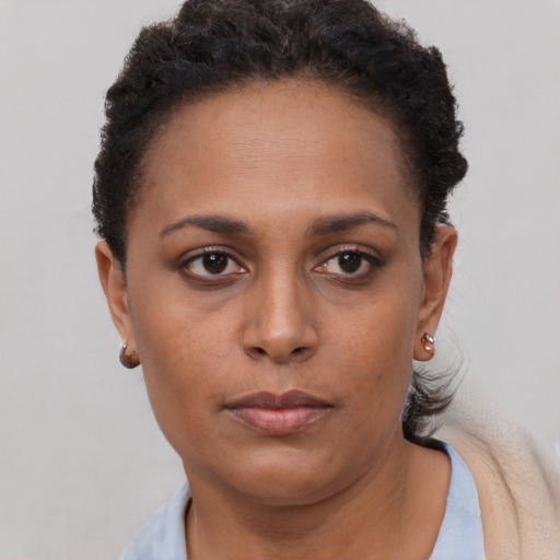Neutral black young-adult female with short  brown hair and brown eyes