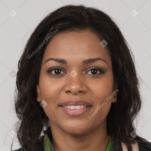 Joyful black young-adult female with long  brown hair and brown eyes