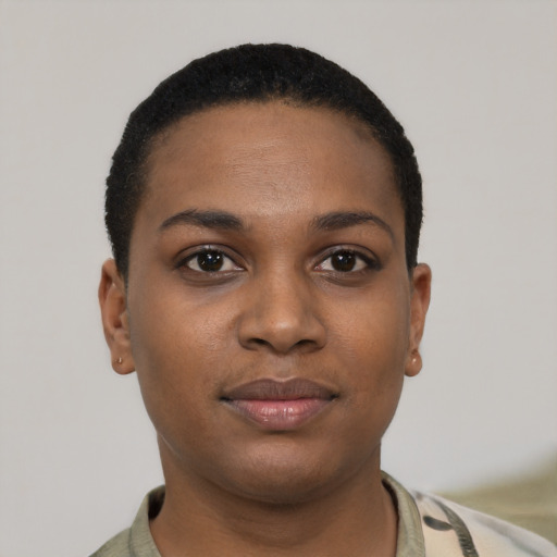 Joyful black young-adult female with short  brown hair and brown eyes