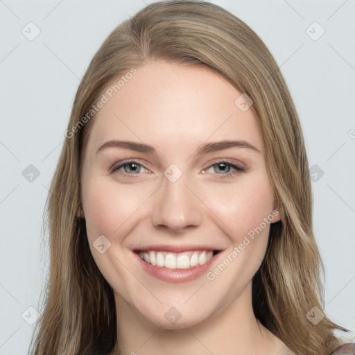 Joyful white young-adult female with long  brown hair and green eyes