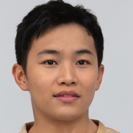 Joyful asian young-adult male with short  brown hair and brown eyes