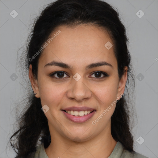 Joyful latino young-adult female with medium  brown hair and brown eyes