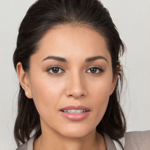 Joyful white young-adult female with medium  brown hair and brown eyes