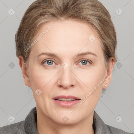 Joyful white adult female with short  brown hair and grey eyes