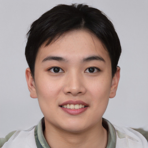 Joyful asian young-adult female with short  black hair and brown eyes