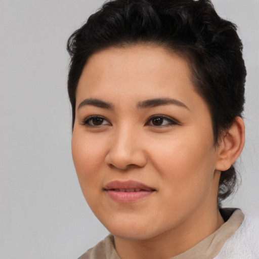 Joyful asian young-adult female with short  brown hair and brown eyes