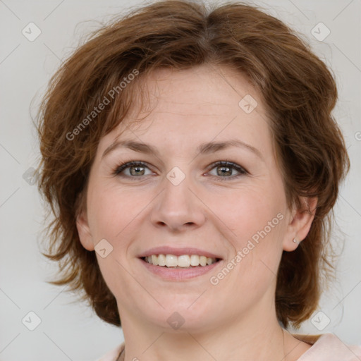 Joyful white young-adult female with medium  brown hair and green eyes