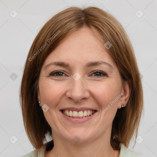 Joyful white adult female with medium  brown hair and grey eyes