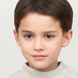 Joyful white child male with short  brown hair and brown eyes