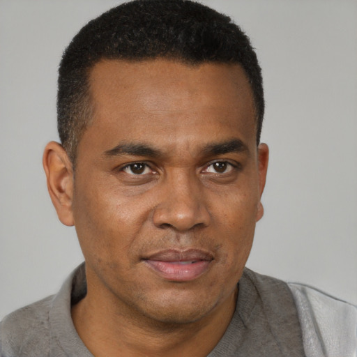 Neutral black young-adult male with short  brown hair and brown eyes