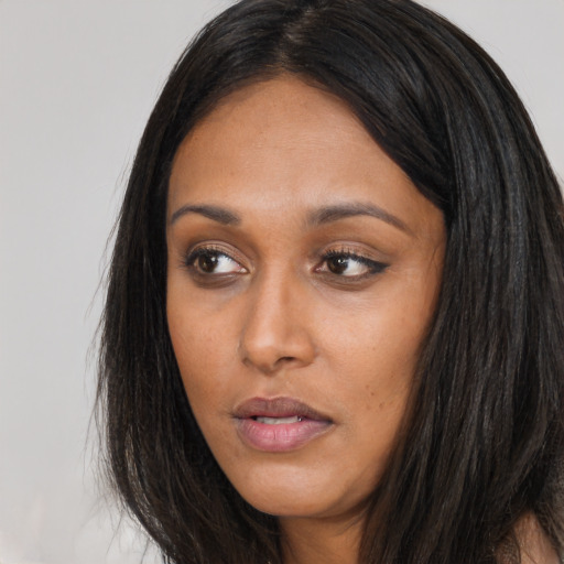Neutral asian young-adult female with long  brown hair and brown eyes