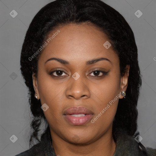 Joyful black young-adult female with long  brown hair and brown eyes