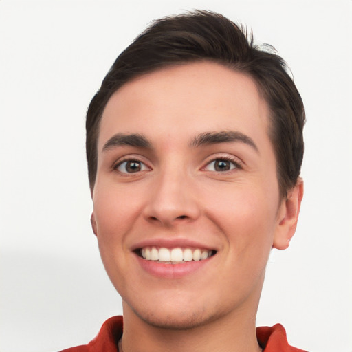 Joyful white young-adult male with short  black hair and brown eyes