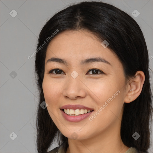 Joyful asian young-adult female with long  brown hair and brown eyes